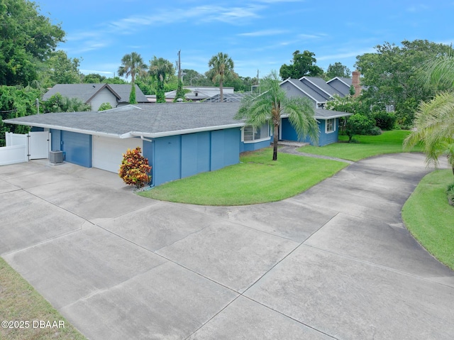 49 Bosarvey Cir, Ormond Beach, FL 32176 - ranch-style home with driveway, a garage, and a shingled roof
