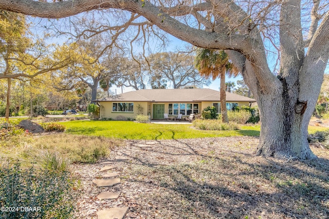 ranch-style house with a front lawn