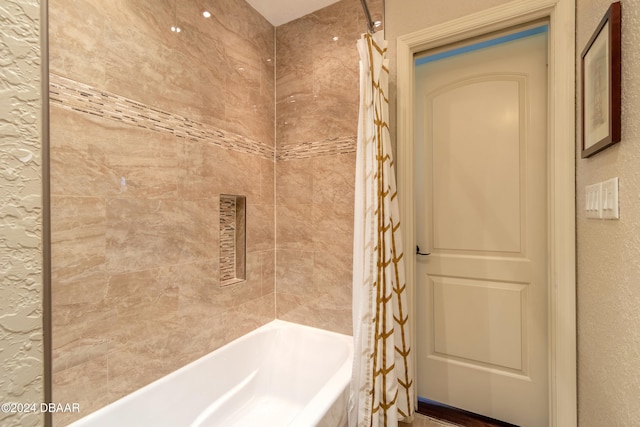 bathroom with shower / bath combination with curtain