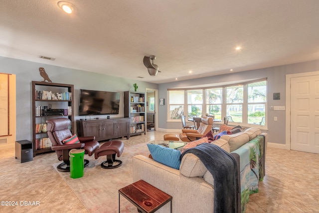 tiled living room with a textured ceiling