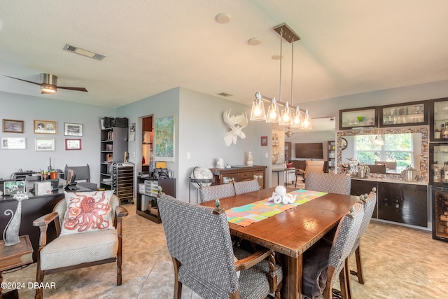 dining room with ceiling fan and a textured ceiling