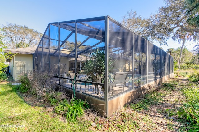 back of house featuring a lanai