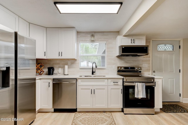 kitchen with white cabinetry, sink, and appliances with stainless steel finishes