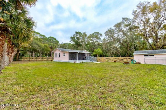 view of yard with a sunroom