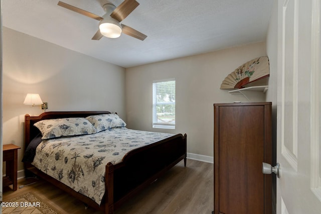 bedroom featuring hardwood / wood-style floors and ceiling fan