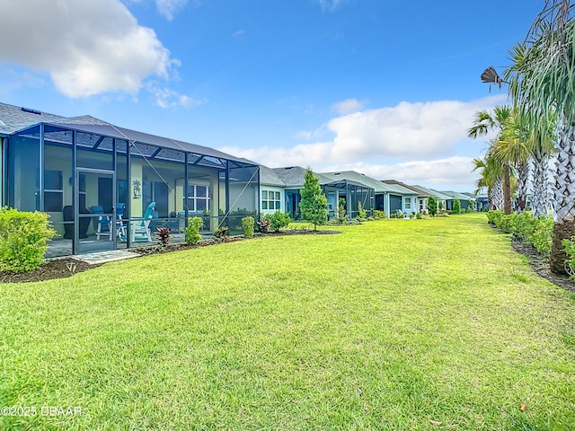 view of yard featuring glass enclosure