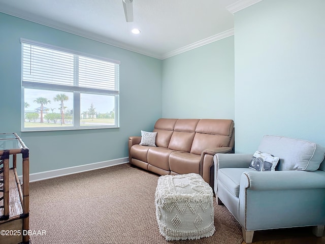 living room with carpet flooring, a wealth of natural light, crown molding, and ceiling fan