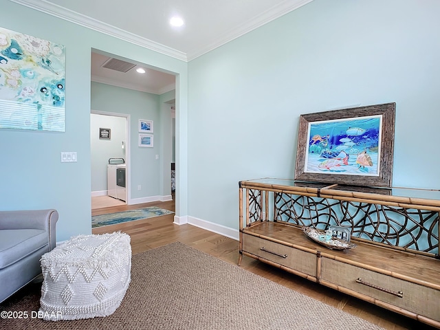 interior space featuring hardwood / wood-style floors and ornamental molding