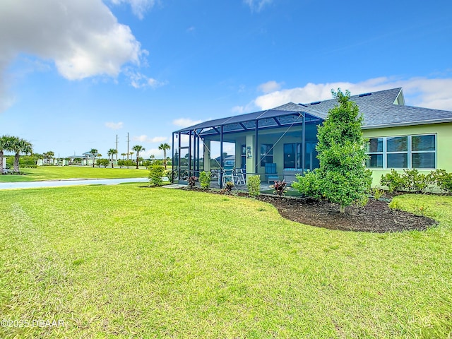 view of yard featuring glass enclosure