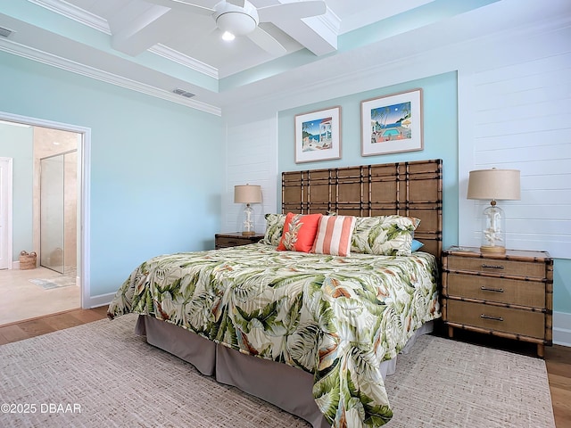 bedroom with coffered ceiling, ceiling fan, light wood-type flooring, connected bathroom, and beamed ceiling