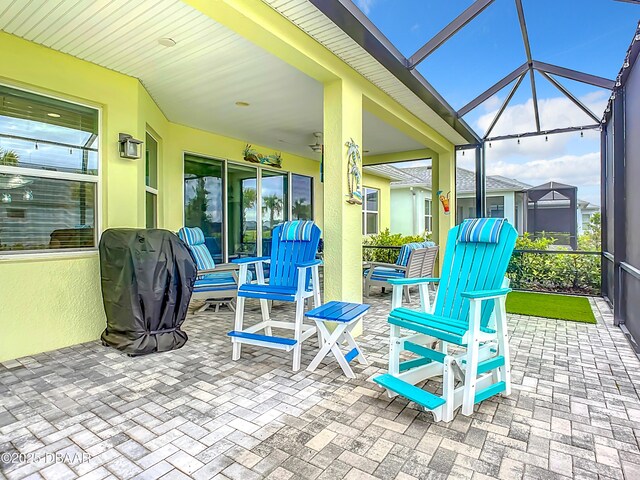 view of patio / terrace featuring area for grilling and a lanai