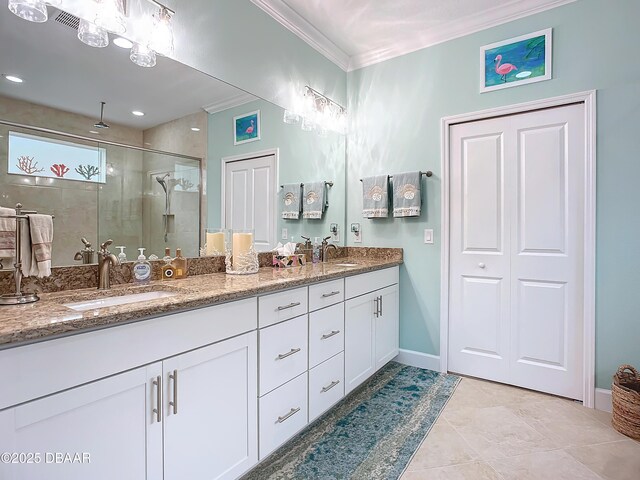 bathroom featuring tile patterned flooring, vanity, an enclosed shower, and ornamental molding