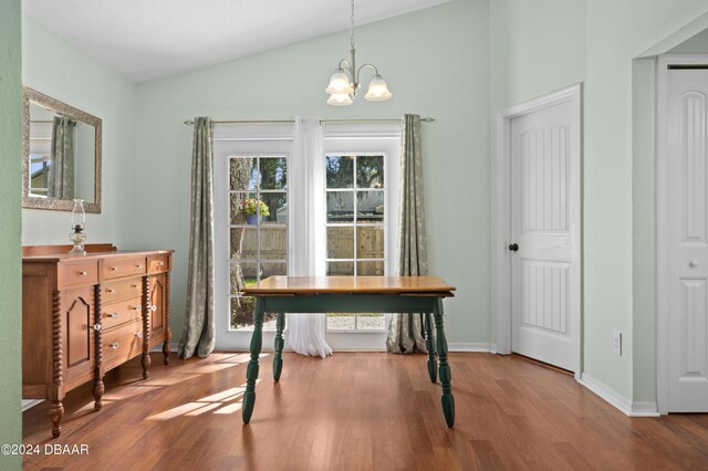 3457 Martingale Ct, Port Orange, FL 32129 - office area featuring lofted ceiling, a chandelier, and wood finished floors