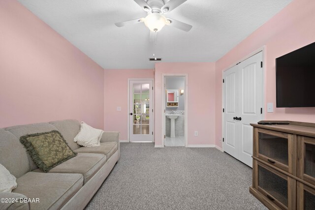 3457 Martingale Ct, Port Orange, FL 32129 - carpeted living area featuring baseboards and a ceiling fan