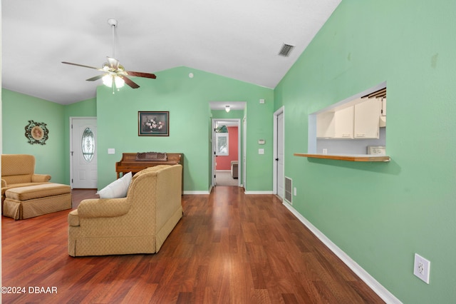 living room with lofted ceiling, dark wood-type flooring, and ceiling fan