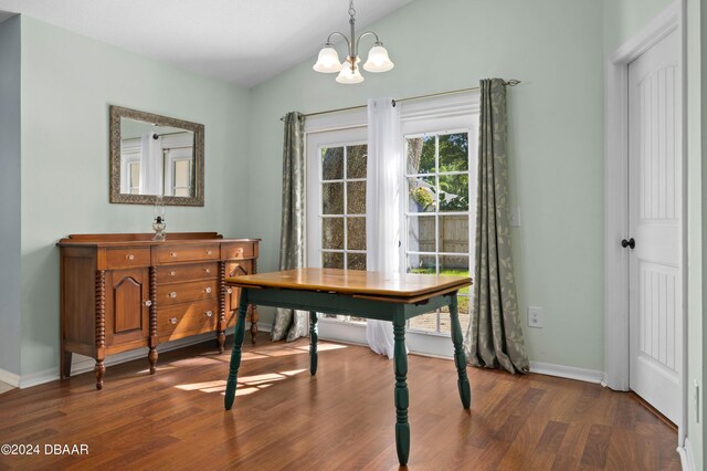 3457 Martingale Ct, Port Orange, FL 32129 - home office with dark wood-style floors and a chandelier