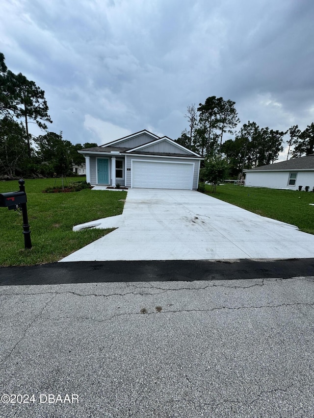 8 Phoenix Ln, Palm Coast, FL 32164 - ranch-style house with an attached garage, a front lawn, and concrete driveway
