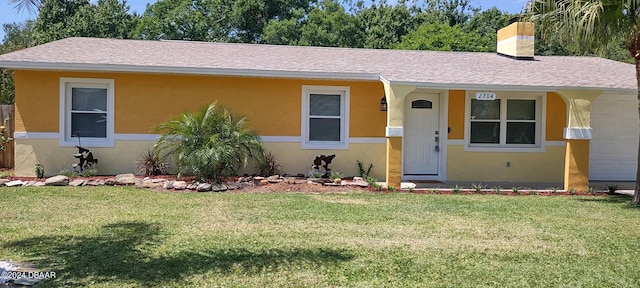 view of front of home with a front lawn