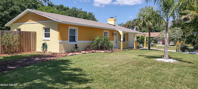 ranch-style house with a front lawn