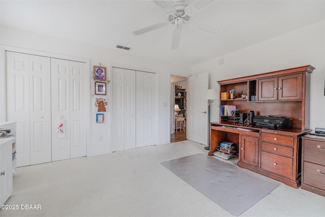 kitchen with light carpet and ceiling fan