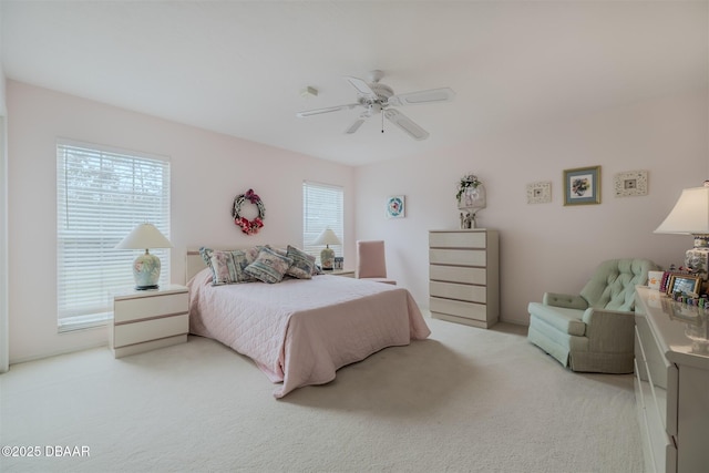 bedroom with light colored carpet and ceiling fan