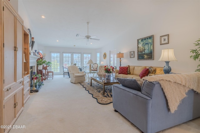 carpeted living room featuring ceiling fan