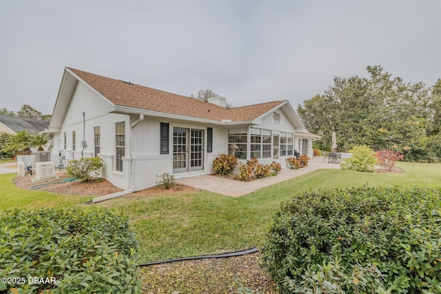 back of house featuring a yard and a patio