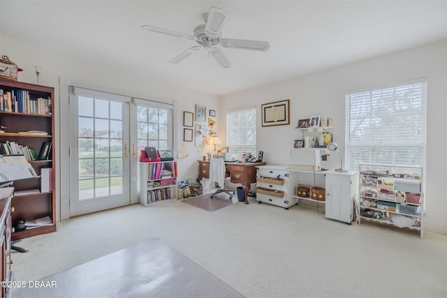 misc room with ceiling fan and carpet floors