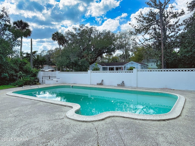 view of pool featuring a patio