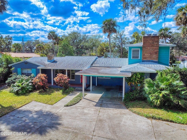 view of front of property with a carport