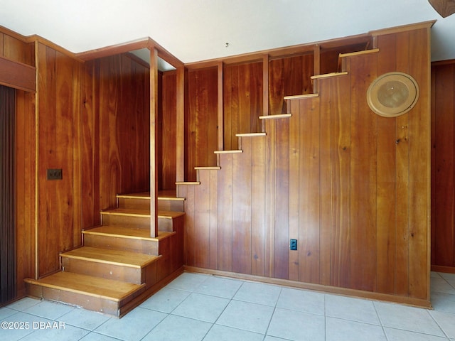 staircase with tile patterned floors and elevator