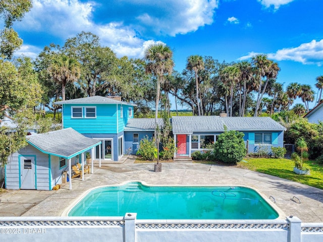 view of swimming pool with a patio area