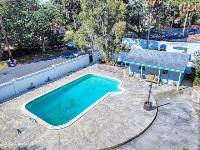 view of swimming pool featuring a patio area