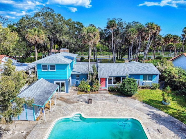 rear view of property featuring a patio