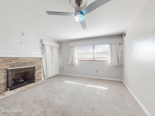 unfurnished living room featuring light carpet and ceiling fan