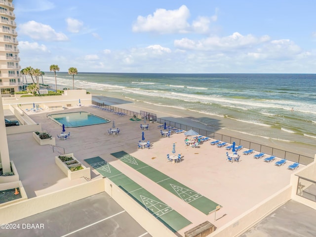 bird's eye view featuring a view of the beach and a water view