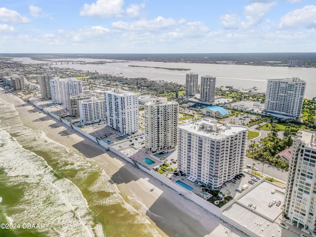 drone / aerial view featuring a view of the beach and a water view