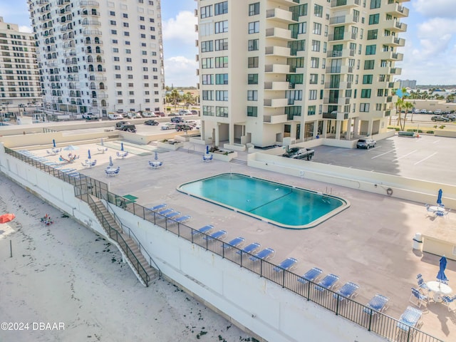 view of swimming pool featuring a patio