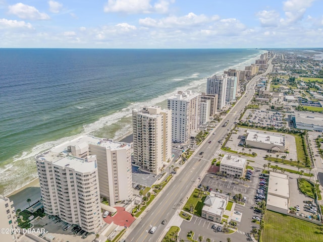 aerial view with a water view and a view of the beach