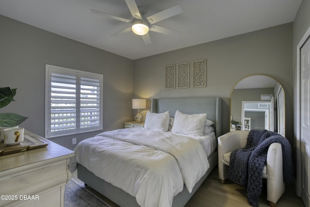 bedroom with wood-type flooring and ceiling fan