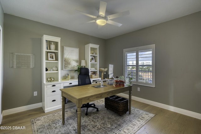 office featuring wood-type flooring and ceiling fan