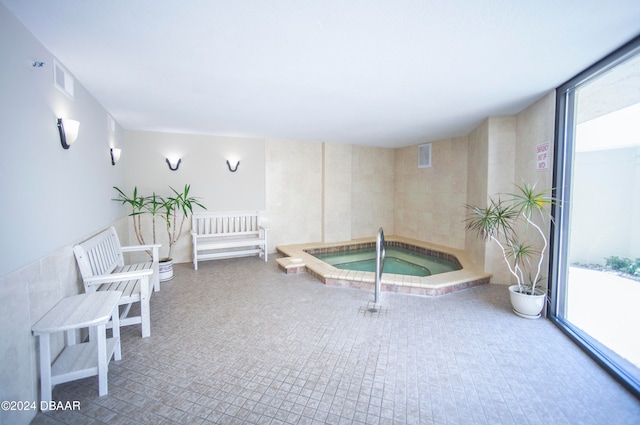 sitting room featuring a swimming pool with hot tub