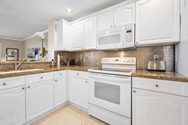 kitchen with white cabinets, sink, white appliances, and crown molding