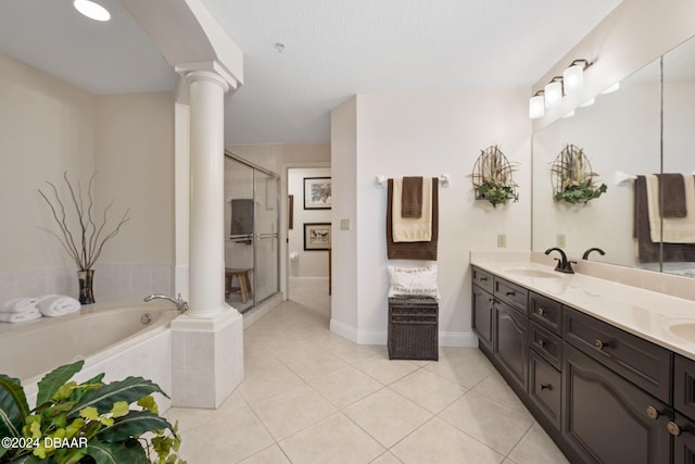 bathroom featuring decorative columns, vanity, tile patterned floors, and separate shower and tub