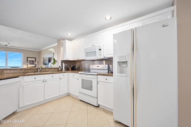 kitchen with sink, ornamental molding, light tile patterned flooring, white cabinetry, and white appliances