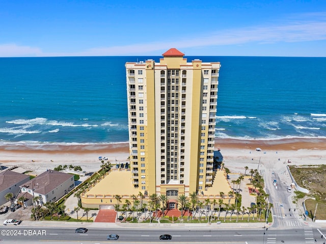 aerial view with a water view and a view of the beach