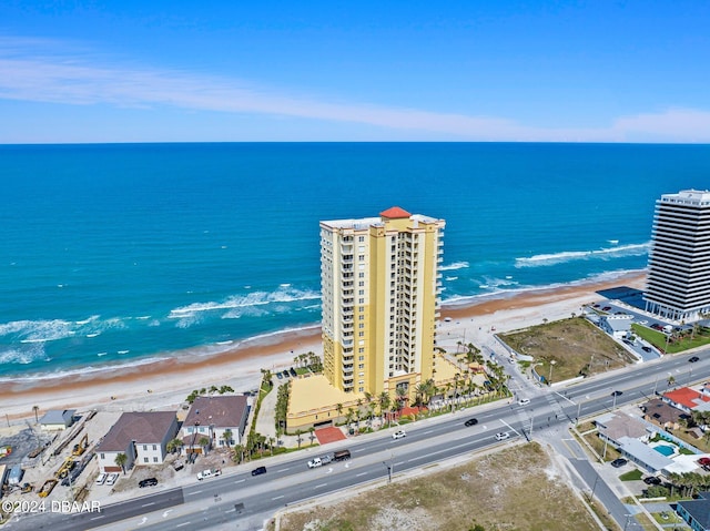 bird's eye view featuring a water view and a view of the beach