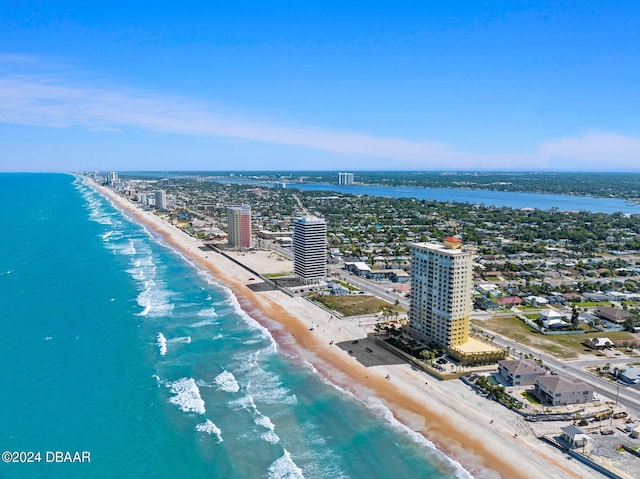 drone / aerial view featuring a view of the beach and a water view