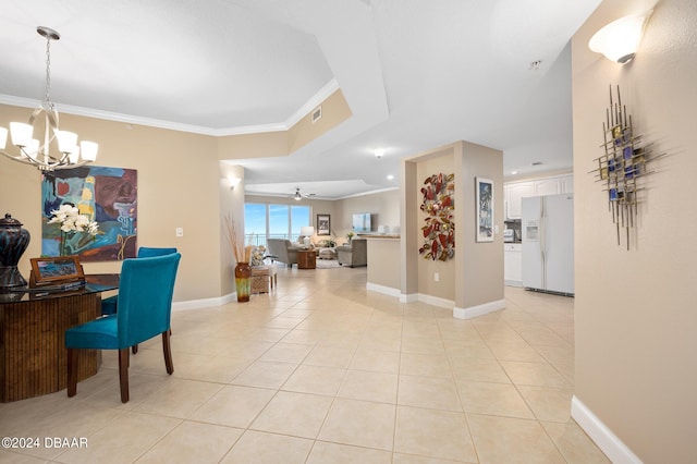 dining area featuring light tile patterned floors, ornamental molding, and ceiling fan with notable chandelier