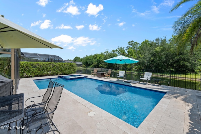 view of swimming pool with a patio area